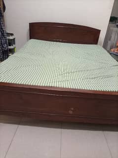 medium size bed, brown bed,