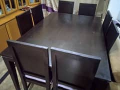 Wooden dining table with 8 chairs