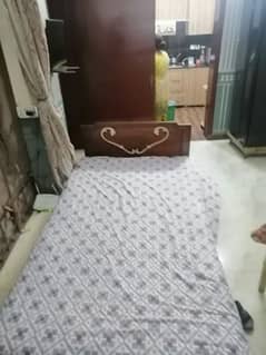 wooden single bed