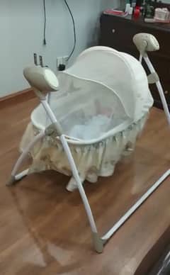 Electric baby cot