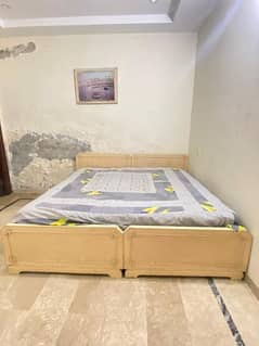 double bed with dressing table and mattress