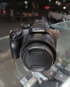 Panasonic Lumix-FZ1000 Digital Camera with original charger strap