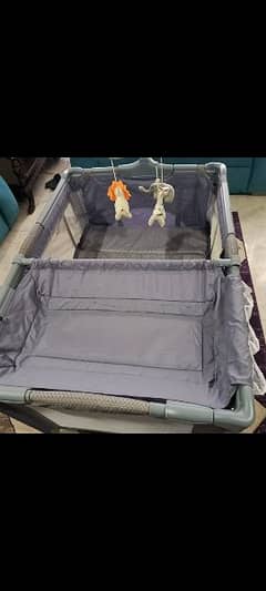 playpen and cot