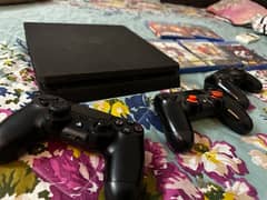 play station 4 slim with 3 controllers and games worth 30k