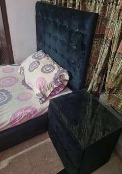 single bed and side table