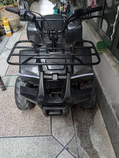 100cc atv carbon fiber wraped very good condition