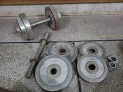 Gym dumbbells for sale: 2 rods, 4 plates of 3kg, and 4 plates of 2kg.