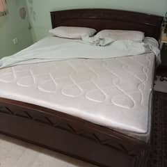 6 x 6.5 feet used Bed with spring Mattress