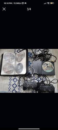 PLAYSTATION 2 WITH 2 HANDLES 40+ CDS