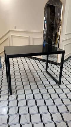 Black Table with iron frame.