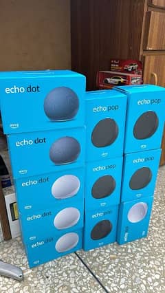 Amazon Echo Pop, Echo Dot, Google Home Mini and JBL GO 3