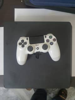 Play Station 4 with one controller and 2 games