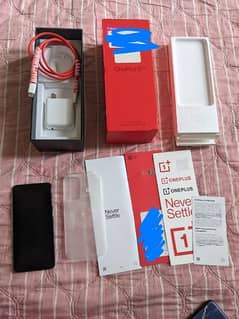 One Plus 9 5G, 8/128GB with original box charger and other accessories