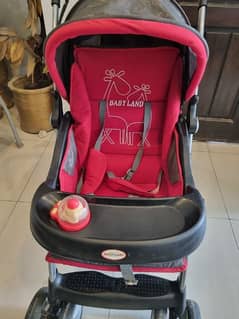 slightly used babyland high quality pram with shocks and big wheels