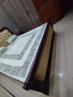 king size bed with side tables and dressing table