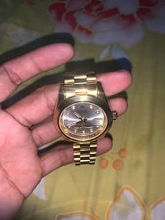 Rolex watch gold colour