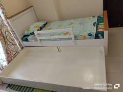 Two single beds with under beds/storage compartment with Wardrobe
