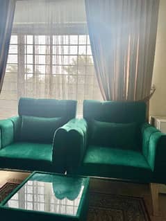 set of 2 sofa chairs with a coffee table