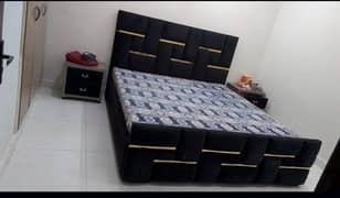 black colour bed with 2 side tables and dressing table
