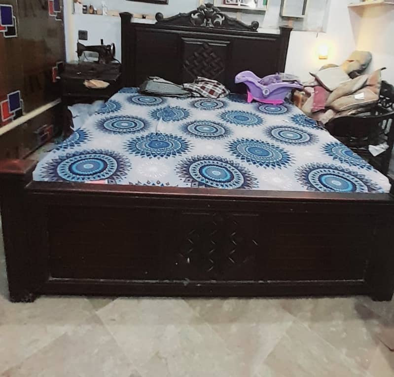 Wooden bed with side table 0