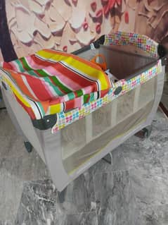 Baby sleeping and pamper changing cot