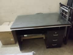 wooden office table with glass top