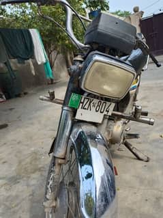 Honda 70 motorcycle with plate number 804