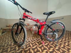 A red mountain foldable bicycle