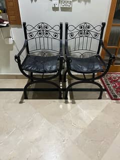 Rot Iron black chairs