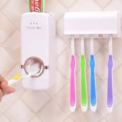 set of toothpaste  and brush holder