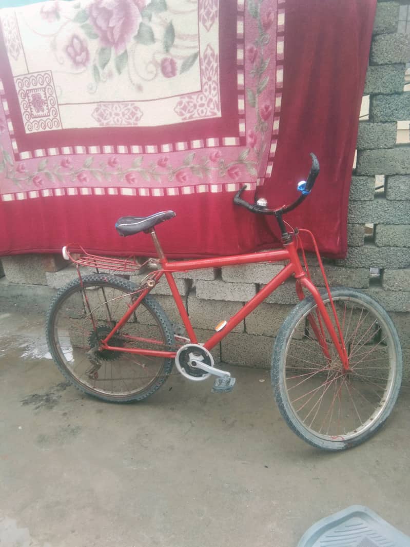 Red geared bicycle for sale 0