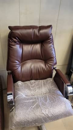 Executive recliner chair with leather finish and metal base