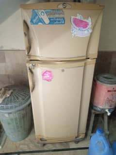 A medium size fridge . sealed ( means no repaired)