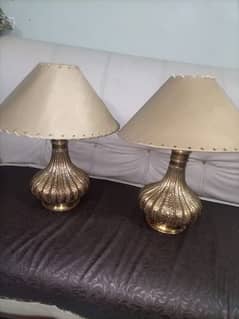 Brass lamps with shades .