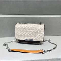 Michael Kors Cross Body Bag in Signature Vanilla.