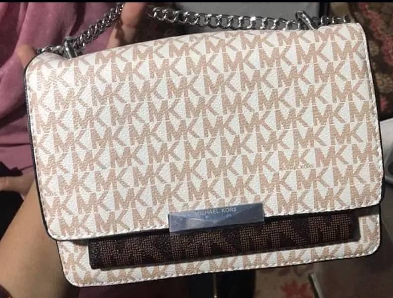 Michael Kors Cross Body Bag in Signature Vanilla. 1