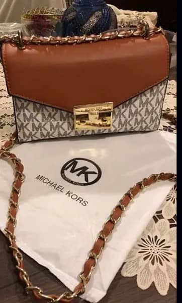 Michael Kors Cross Body Bag in Signature Vanilla. 2