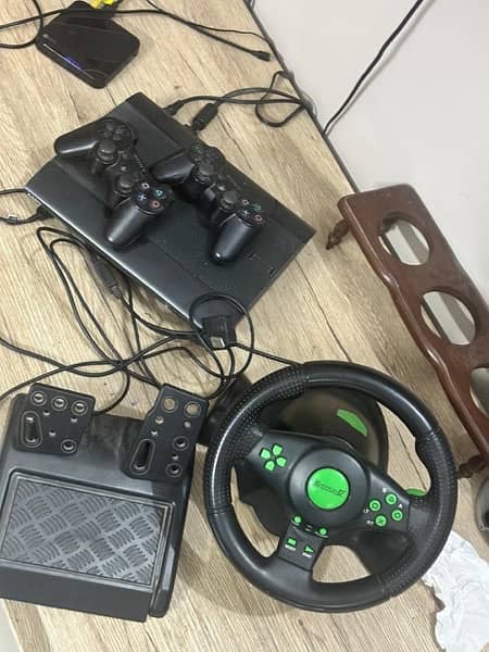 ps3 with games and steering 4