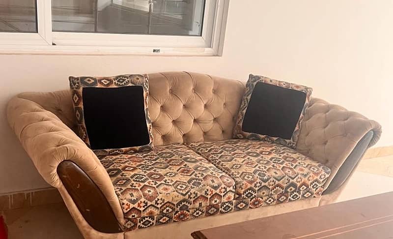 Two seater wooden sofa with cushions for sale 1