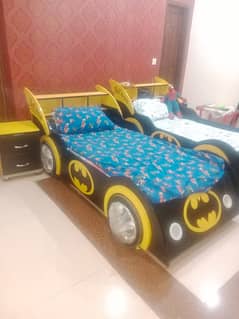 2 car designed beds with 2 side tables