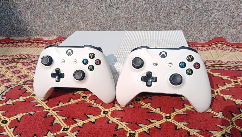 xbox one s with 6 games and an extra controller 2