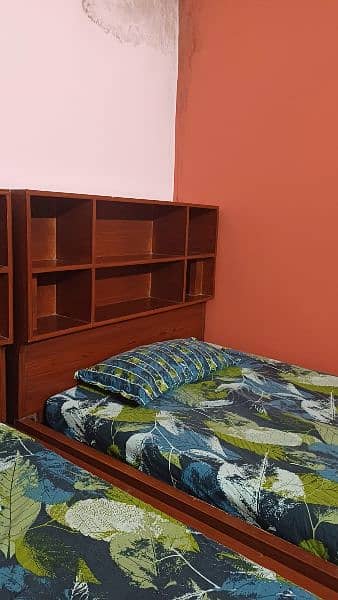 2 single bed with shelves for books and big drawers  for other stuff 2