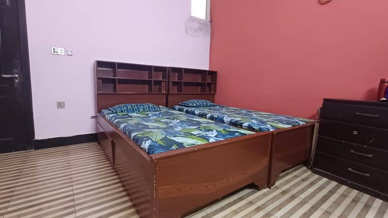 2 single bed with shelves for books and big drawers  for other stuff 4