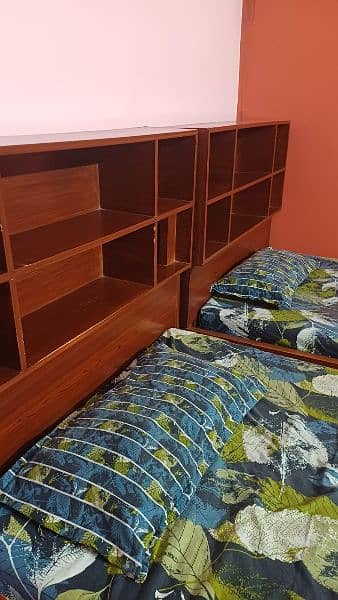 2 single bed with shelves for books and big drawers  for other stuff 5