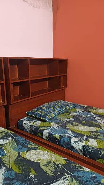 2 single bed with shelves for books and big drawers  for other stuff 7