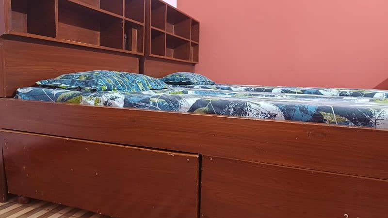 2 single bed with shelves for books and big drawers  for other stuff 9