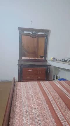 Master size bed with side tables and dressing table