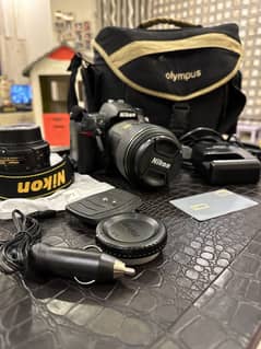 Nikon d7000 with full accessories, bag, 18-55mm lens and 105mm macro