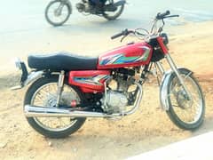 Honda 125 in Red for sale ( it feels like flying riding it )