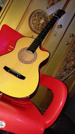 38 inches  acoustic guitar  Yellow brown colour , 1 month used 0